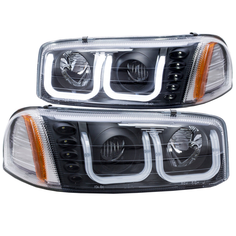 ANZO 1999-2006 GMC Sierra 1500 projector headlights with U-Bar in black housing, showcasing clear lens and modern design.