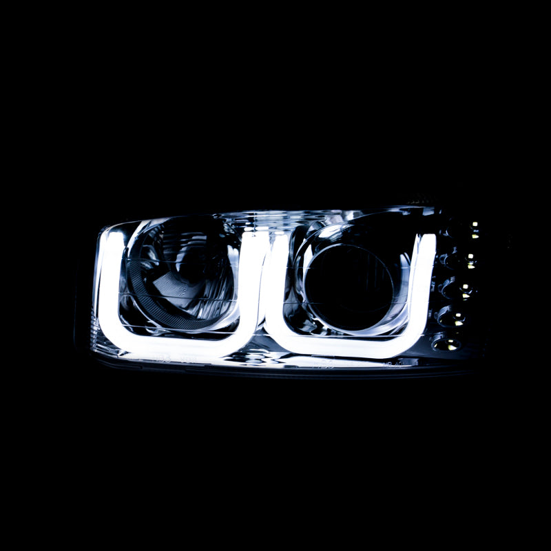 ANZO 1999-2006 GMC Sierra 1500 projector headlights with U-Bar in black housing, showcasing clear lens and modern design.