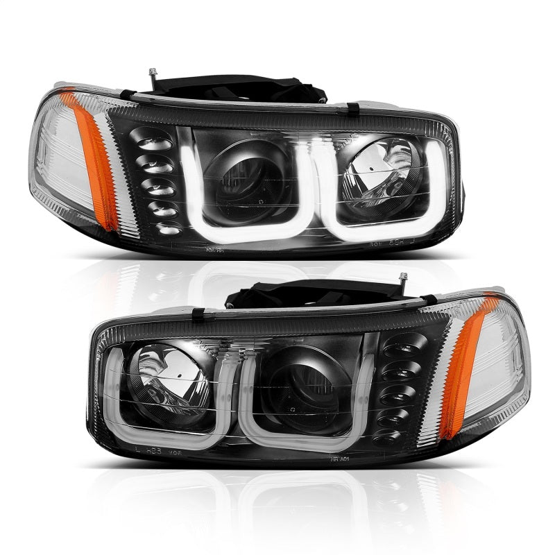 ANZO 1999-2006 GMC Sierra 1500 projector headlights with U-Bar in black housing, showcasing clear lens and modern design.