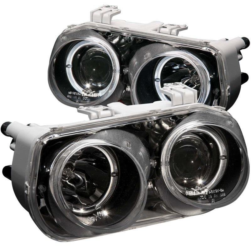 ANZO projector headlights for 1994-1997 Acura Integra with halo lights and black housing, showcasing clear lens and modern design.