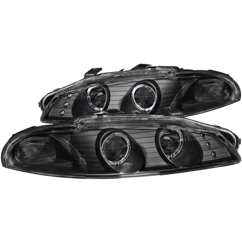 ANZO 1997-1999 Mitsubishi Eclipse projector headlights with halo black housing, showcasing clear lens and stylish design.