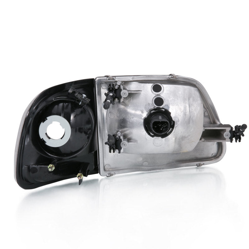 ANZO Crystal Headlight Set for 1997-2003 Ford F150 with clear lens and black housing.