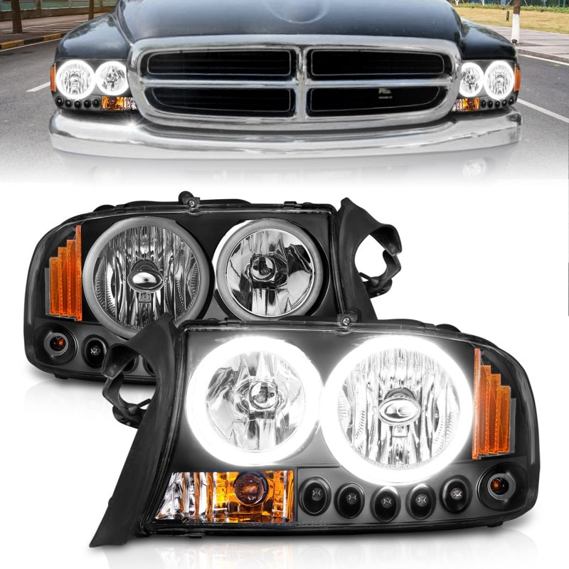 ANZO 1997-2004 Dodge Dakota Crystal Headlights with black housing and clear lens, showcasing sleek design and modern aesthetics.