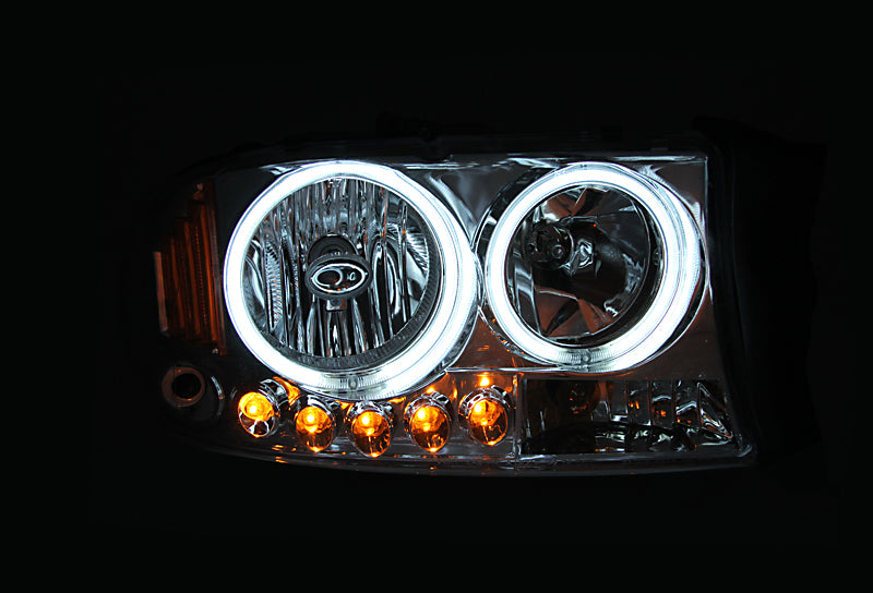 ANZO 1997-2004 Dodge Dakota Crystal Headlights with chrome housing and clear lens, showcasing their sleek design.