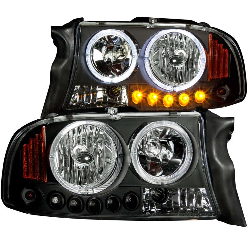 ANZO 1997-2004 Dodge Dakota Projector Headlights with Halo, featuring black housing and clear lens design.