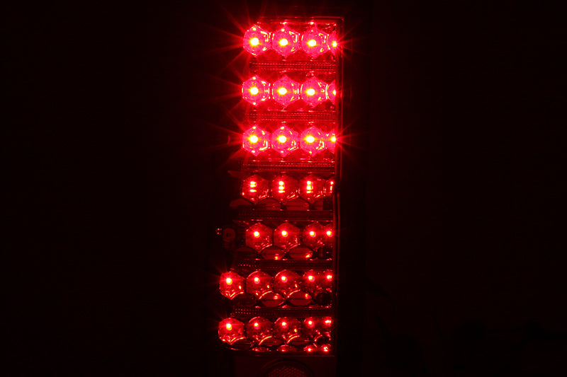 ANZO LED taillights for 1986-1997 Nissan Hardbody, featuring a red and clear lens design.