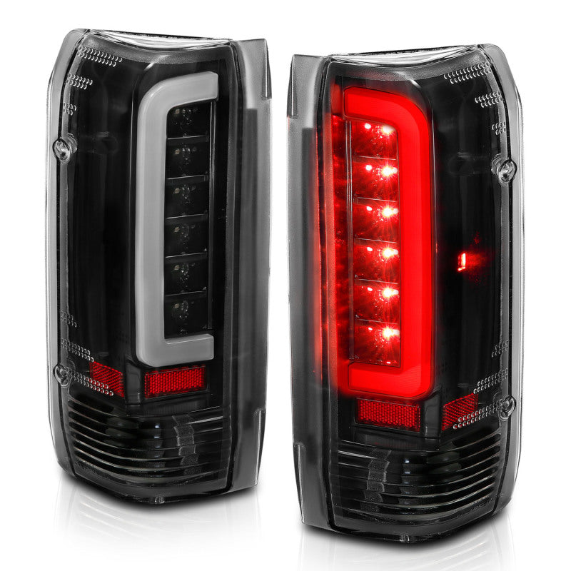 ANZO LED taillights for 1987-1996 Ford F-150 with black housing and clear lens, showcasing modern design and enhanced visibility.