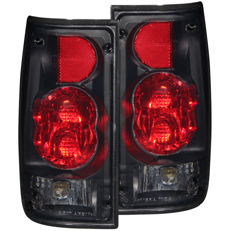 ANZO 1989-1995 Toyota Pickup taillights with dark smoke lens, showcasing a sleek design for enhanced vehicle appearance.