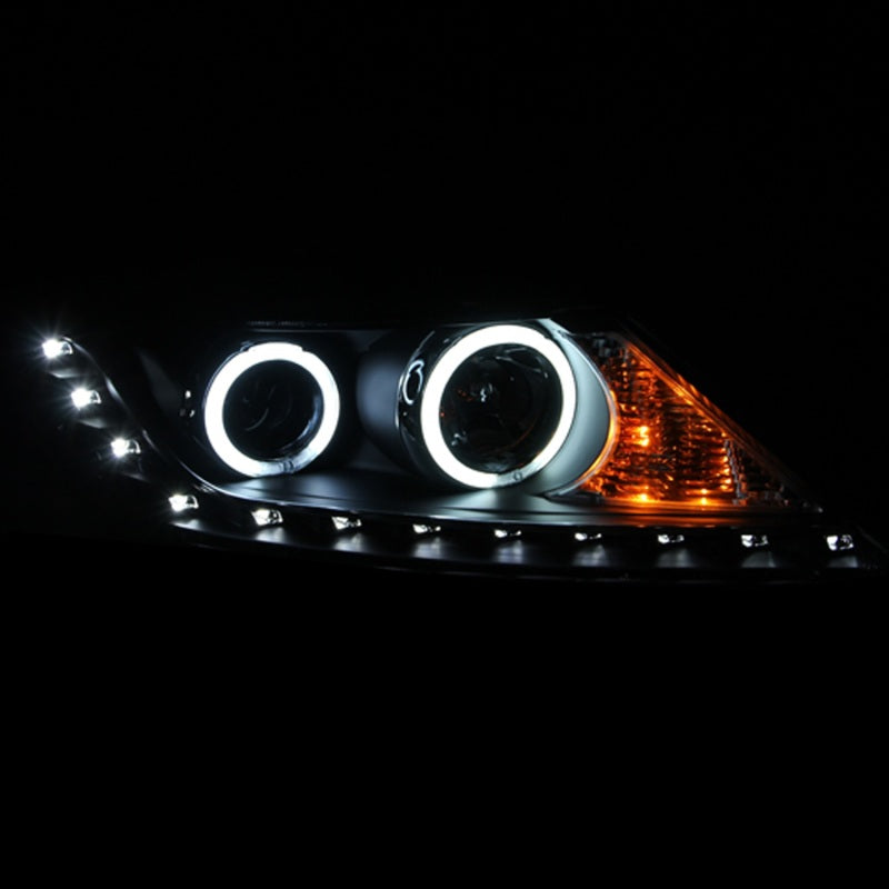 ANZO 2011-2013 Kia Sorento Projector Headlights with Halo Black, featuring clear lens and black housing for enhanced style and visibility.