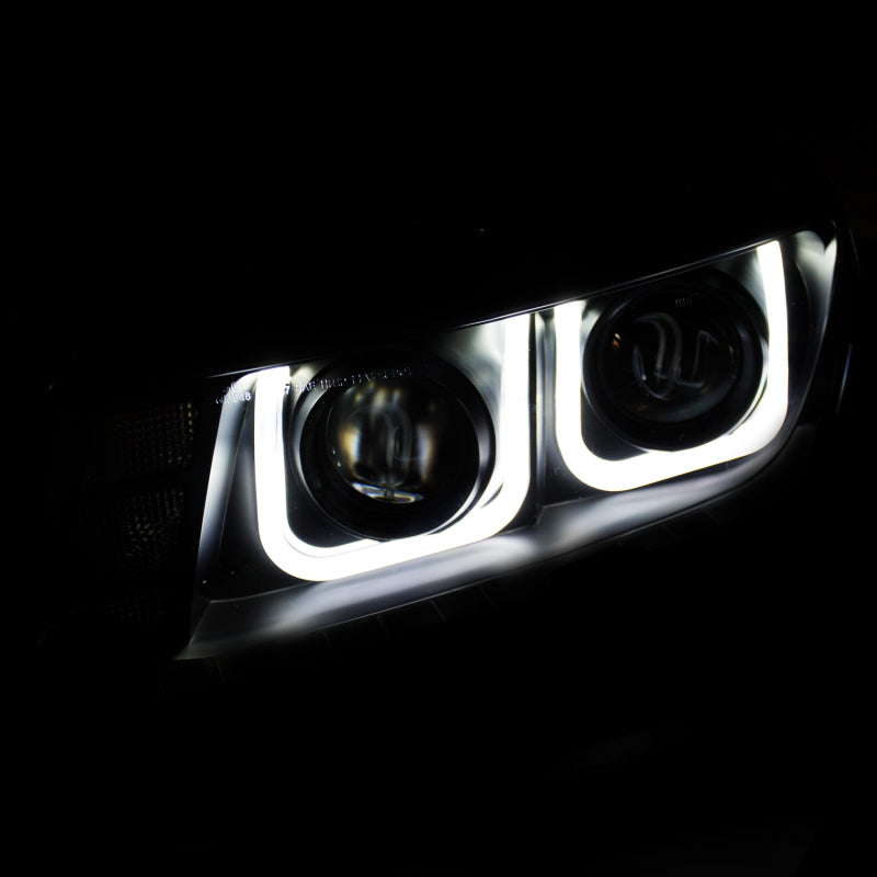 ANZO 2014-2015 Chevrolet Camaro projector headlights with U-Bar design in black, showcasing modern styling and superior illumination.