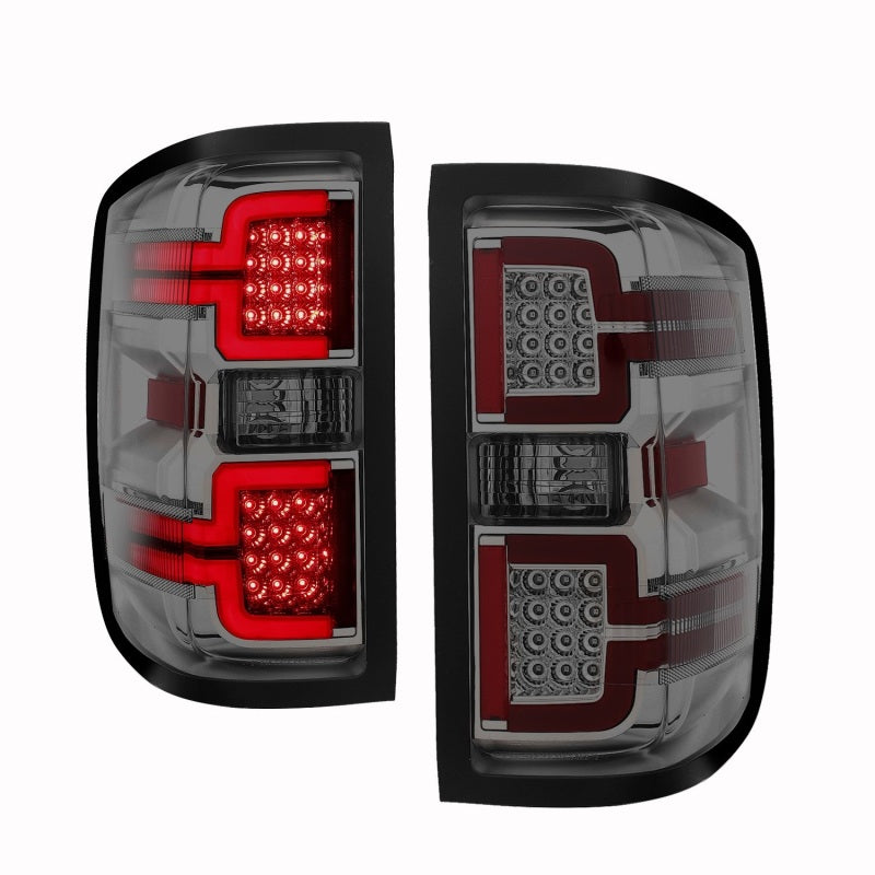 ANZO LED taillights for 2014-2018 Chevy Silverado 1500 with a smoke lens, showcasing modern design and bright LED technology.