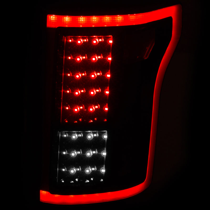 ANZO 2015-2016 Ford F-150 LED taillights in black with clear lens and chrome housing.