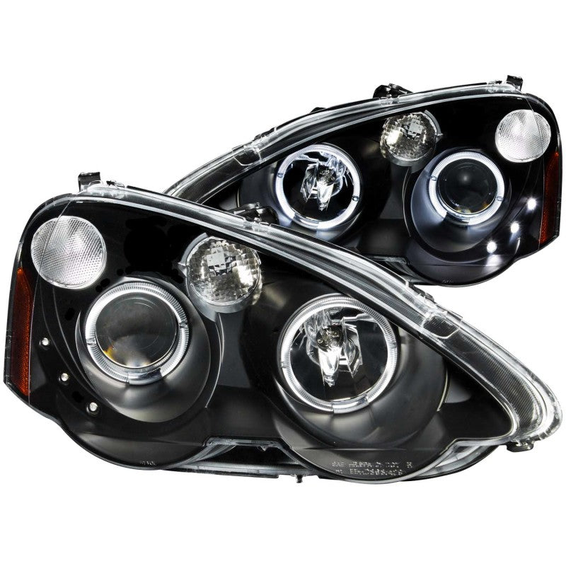 ANZO projector headlights for 2002-2004 Acura RSX with halo feature and black housing, showcasing clear lens and modern design.