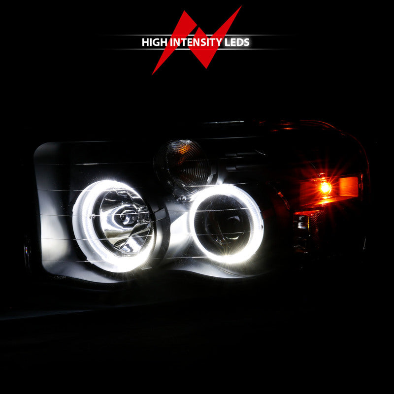 ANZO 2002-2005 Dodge Ram 1500 projector headlights with halo design, featuring black housing and clear/amber lens.