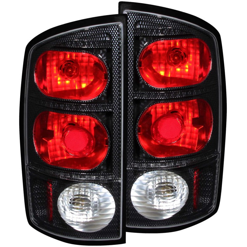 ANZO 2002-2005 Dodge Ram 1500 taillights featuring clear/red lens and carbon housing, enhancing vehicle appearance and visibility.