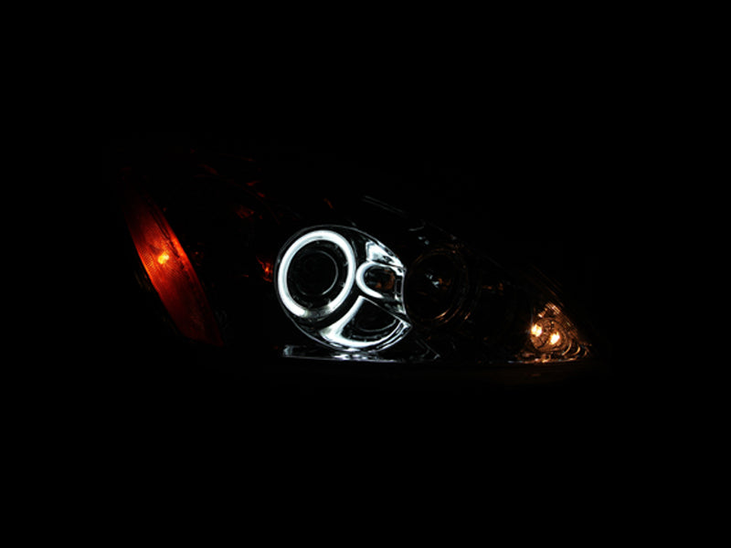 ANZO 2004-2007 Mitsubishi Lancer Projector Headlights with Halo Chrome, showcasing clear lens and chrome housing.