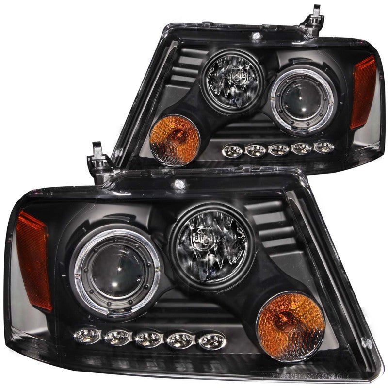 ANZO 2004-2008 Ford F-150 projector headlights featuring halo and LED lights with black housing and clear lens.