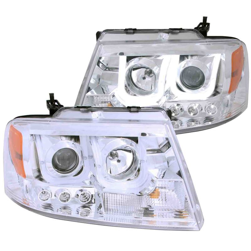 ANZO 2004-2008 Ford F-150 projector headlights with U-Bar chrome housing, showcasing clear lens and modern design.