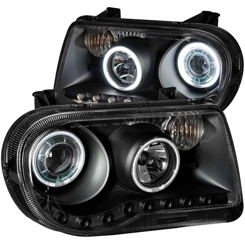 ANZO 2005-2010 Chrysler 300C Projector Headlights with Halo Black, featuring clear lens and sleek black housing.