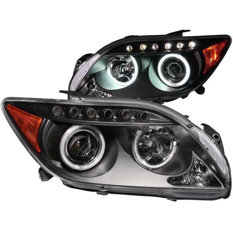 ANZO 2005-2010 Scion tC projector headlights with black housing and halo CCFL rings, showcasing modern automotive lighting design.