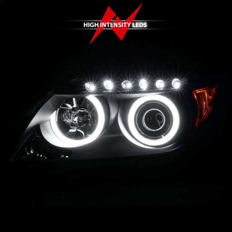 ANZO 2005-2010 Scion tC projector headlights with black housing and halo CCFL rings, showcasing modern automotive lighting design.