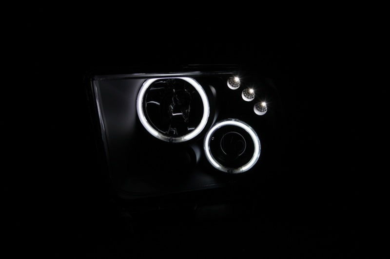 ANZO 2005-2009 Ford Mustang projector headlights with halo black design, showcasing clear lens and black housing.