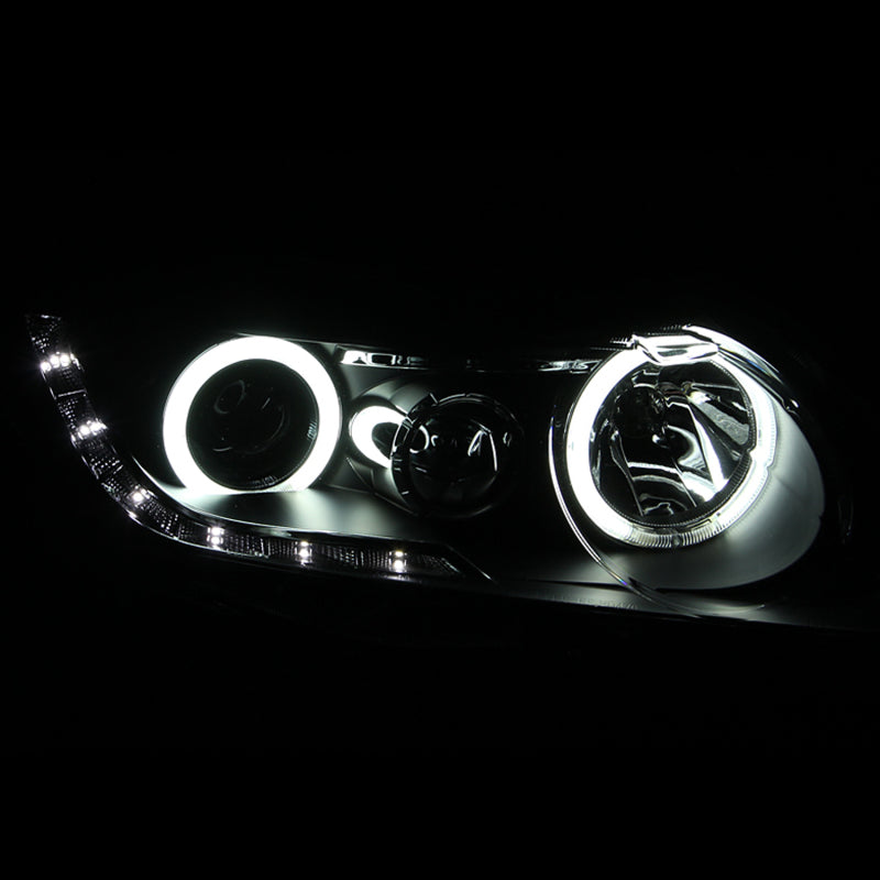 ANZO 2006-2011 Honda Civic Projector Headlights with Halo Black design, featuring clear lens and black housing.