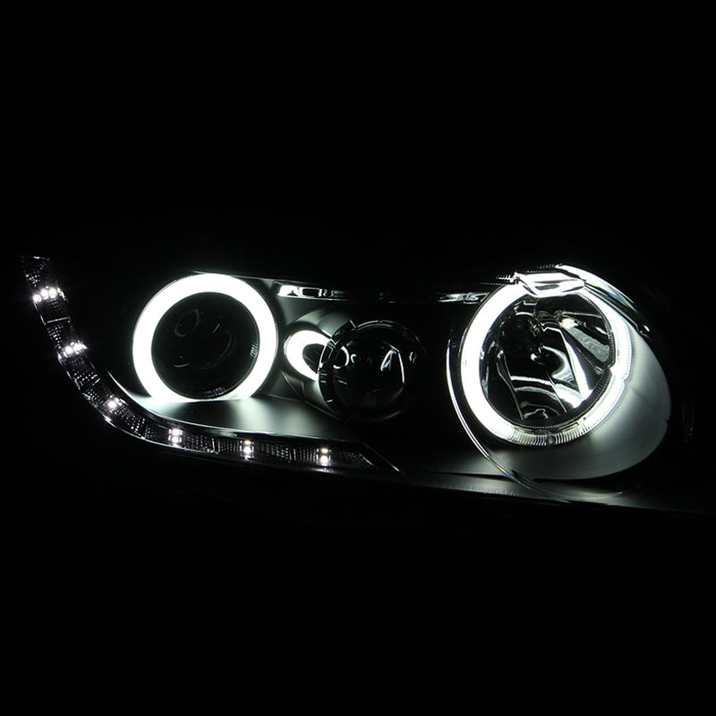 ANZO 2006-2011 Honda Civic Projector Headlights with Halo Black design, featuring clear lens and black housing.