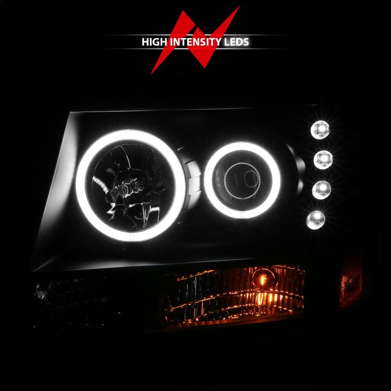 ANZO 2007-2013 Chevrolet Avalanche projector headlights with halo feature and black housing, showcasing modern design and clear lens.