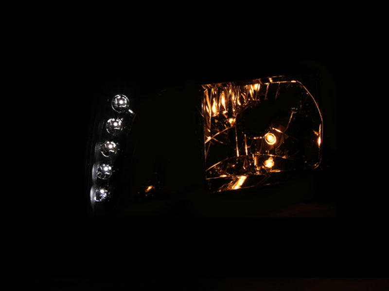 ANZO 2007-2014 Chevy Tahoe Crystal Headlight with Chrome Amber finish, showcasing its sleek design and clear lens.