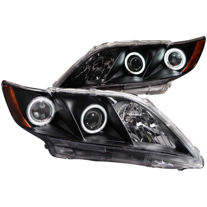 ANZO 2007-2009 Toyota Camry Projector Headlights with Halo design in black housing and clear lens, showcasing modern automotive lighting.