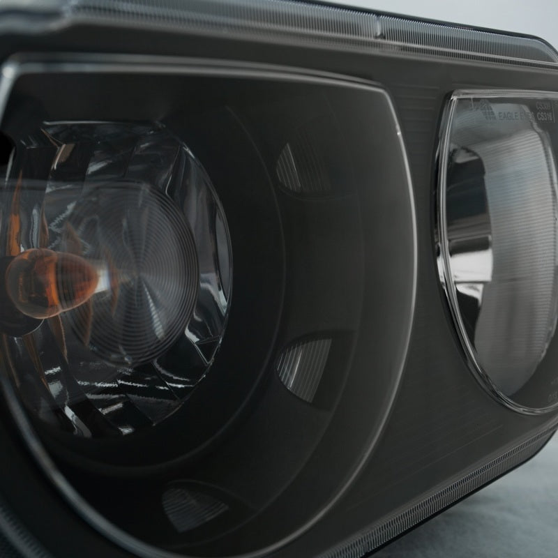 ANZO 2008-2014 Dodge Challenger Crystal Headlights with black housing and clear lens, showcasing modern design and superior lighting.