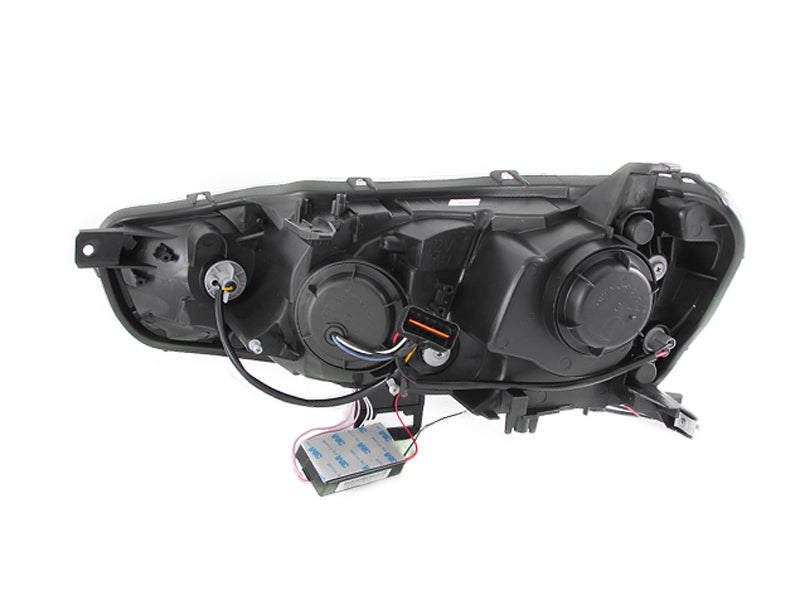 ANZO 2008-2015 Mitsubishi Lancer Projector Headlights with Halo Black design, featuring clear lens and black housing.