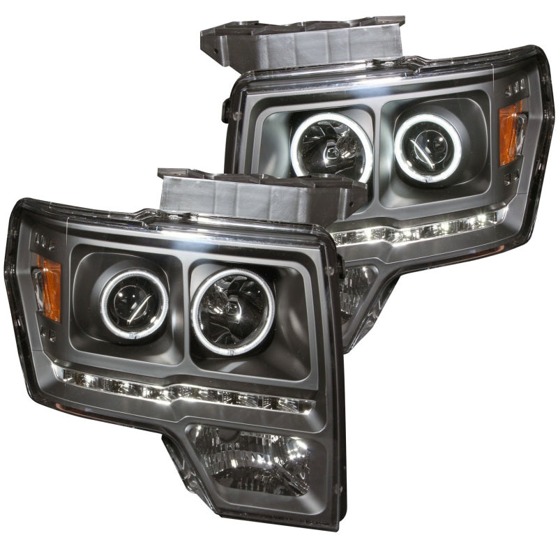 ANZO 2009-2014 Ford F-150 Projector Headlights with Halo Black CCFL, showcasing sleek black housing and clear lens design.