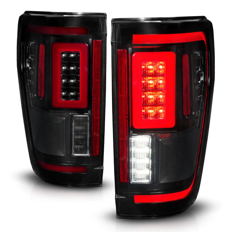 ANZO LED taillights for 2021-2023 Ford F-150 in black with sequential signals and BLIS cover, showcasing modern design and enhanced safety features.