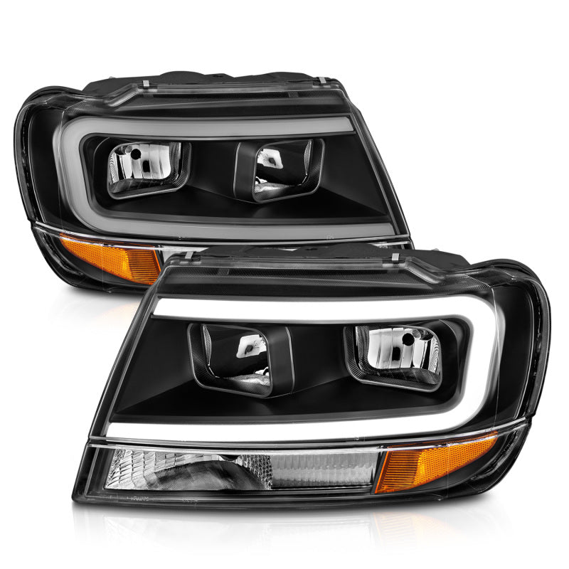 ANZO Crystal Headlights for 1999-2004 Jeep Grand Cherokee with black housing and clear lens, showcasing modern design and enhanced visibility.