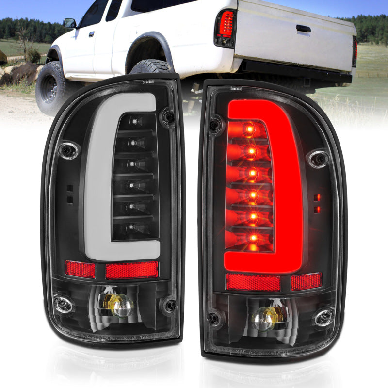 ANZO LED taillights for 95-00 Toyota Tacoma featuring black housing and clear lens, enhancing vehicle visibility and style.