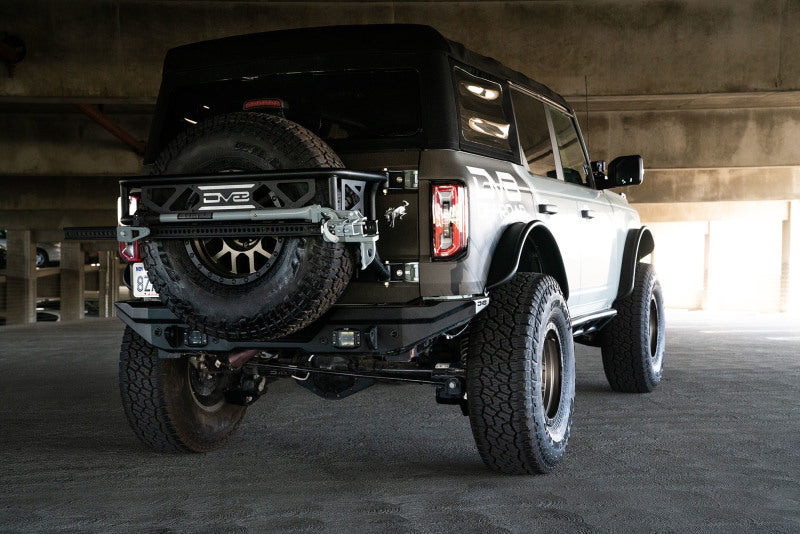 DV8 21-22 Ford Bronco 3rd Brake Light Extension Bracket mounted on a Bronco, showcasing its compatibility with larger spare tires.