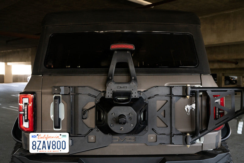 DV8 21-22 Ford Bronco 3rd Brake Light Extension Bracket mounted on a Bronco, showcasing its compatibility with larger spare tires.