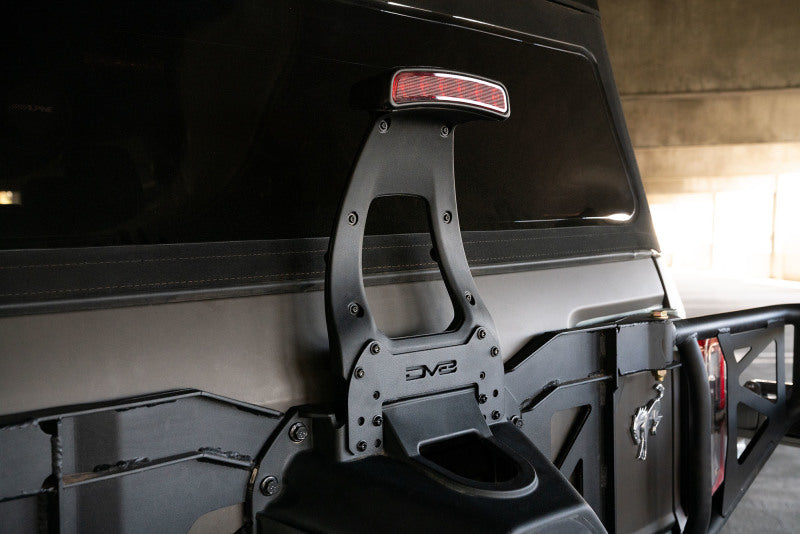 DV8 21-22 Ford Bronco 3rd Brake Light Extension Bracket mounted on a Bronco, showcasing its compatibility with larger spare tires.