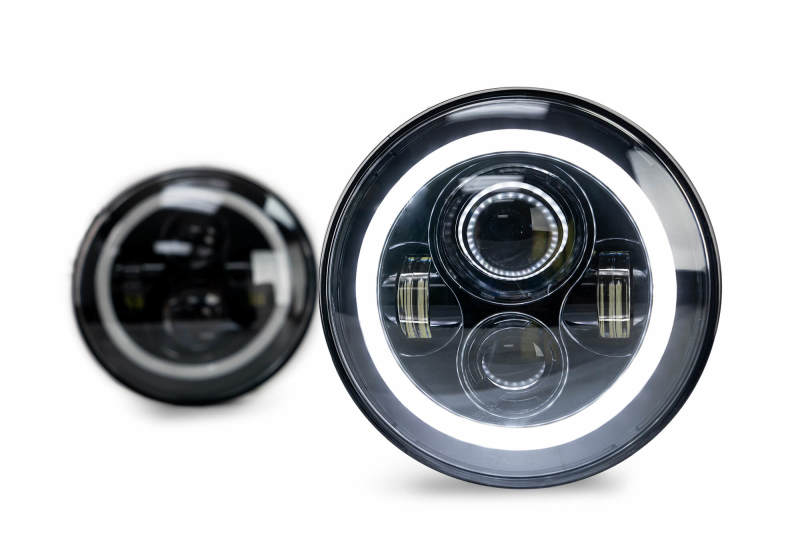 DV8 Offroad LED Projector Headlights for Jeep Wrangler JK with Angel Eye light rings, showcasing bright white light and modern design.