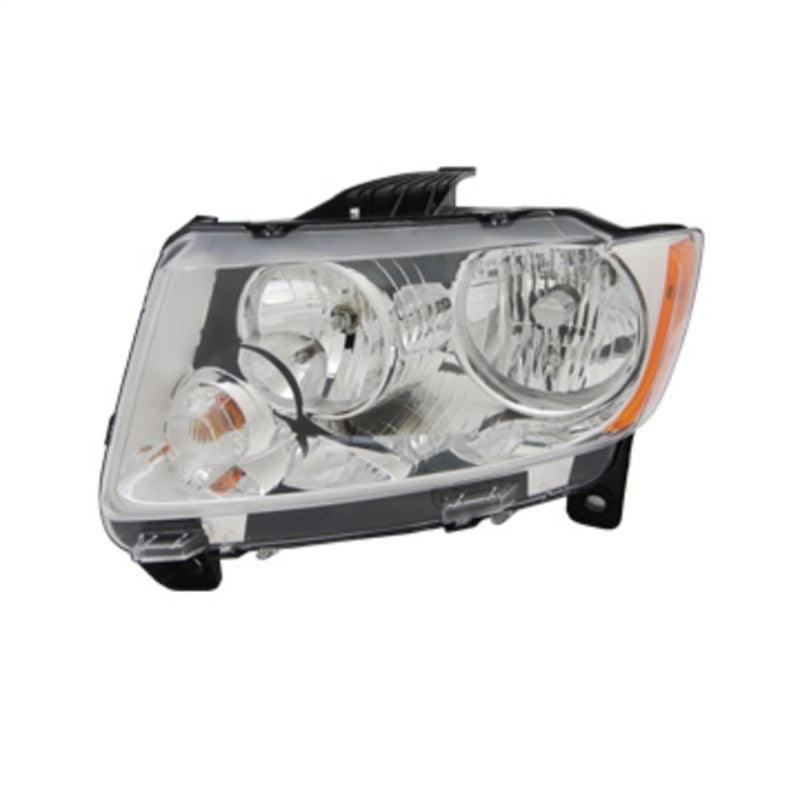 Omix Headlight Assembly for left side of 2011-2013 Jeep Grand Cherokee, showcasing clear lens and durable construction.