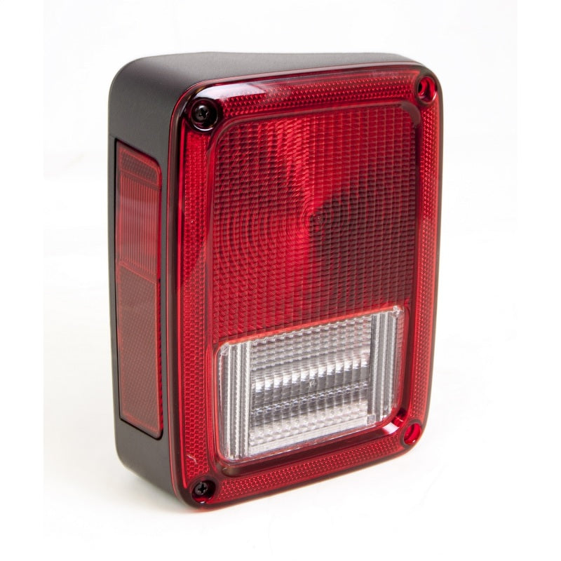 Omix Left Tail Light for 07-18 Jeep Wrangler JK, showcasing its durable design and clear lens for optimal visibility.