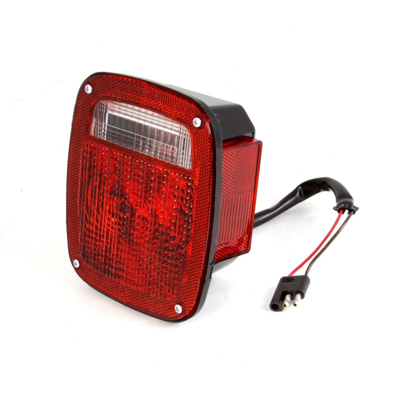 Omix Right Black Tail Lamp for 81-86 Jeep CJ models, featuring a durable black plastic housing designed for passenger side installation.