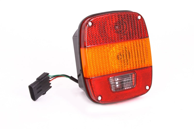 Omix Tail Light for 87-95 Jeep Wrangler YJ Export, featuring amber center lens and designed for left or right side installation.