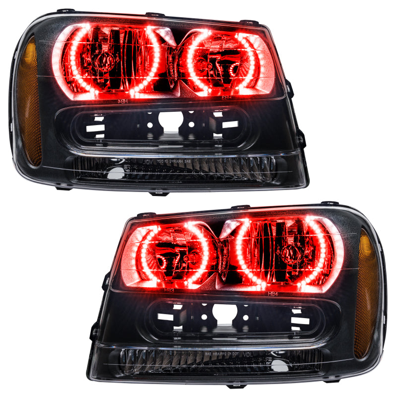 Oracle 02-09 Chevrolet Trail Blazer SMD headlights in red with halo rings, showcasing pre-assembled design and chrome housing.