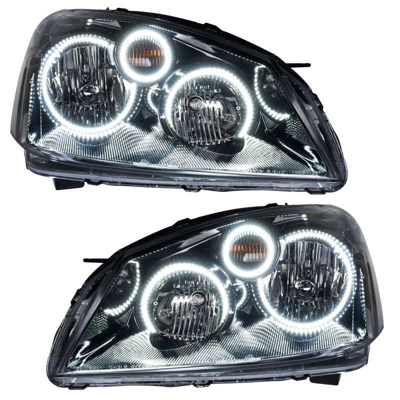 Oracle 05-06 Nissan Altima SMD headlights with white halo rings, showcasing chrome housing and professional installation.