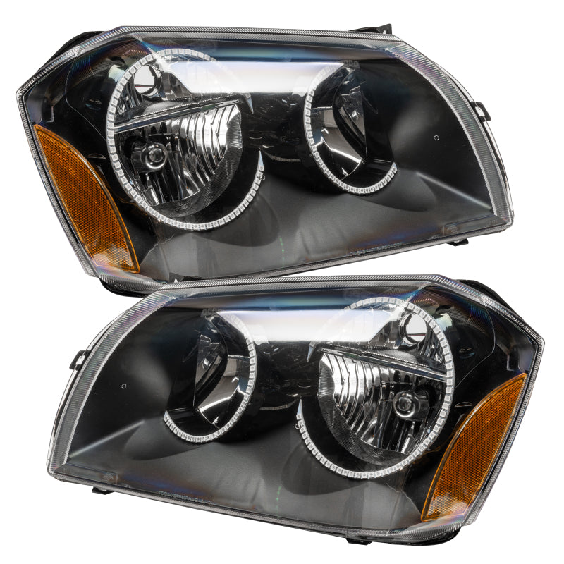 Oracle 05-07 Dodge Magnum SMD Headlights in Black with ColorSHIFT technology, showcasing professional halo installation.