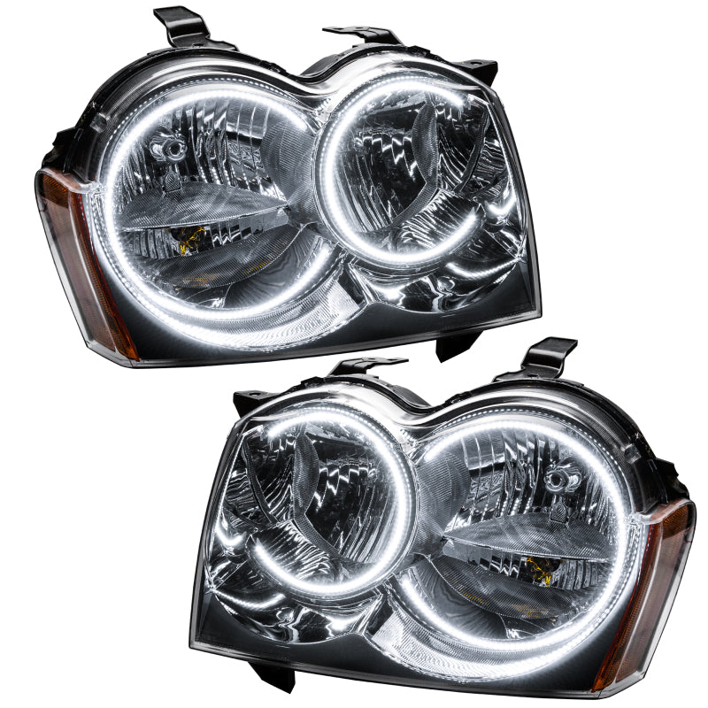 Oracle 05-07 Jeep Grand Cherokee SMD HL headlights with white halo rings, showcasing chrome and black housing options.