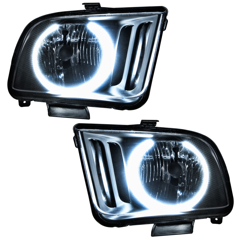 Oracle 05-09 Ford Mustang SMD headlights with white halo rings, showcasing chrome and black housing options.